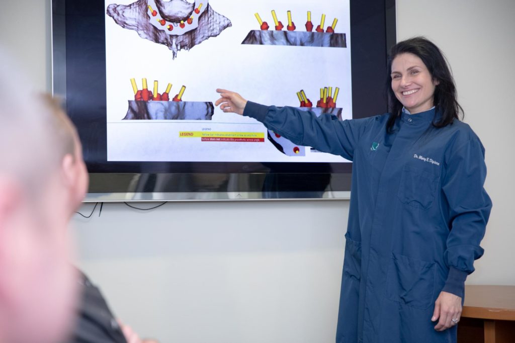Dr. Mary DiPirro demonstrates dental technology