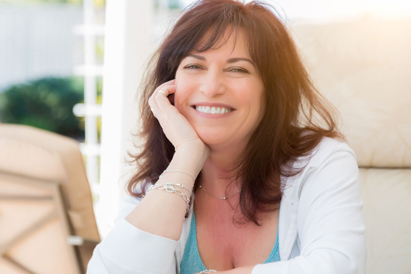 patient smiling after dental implants procedure Peabody, MA