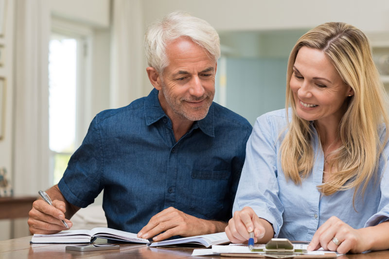 patients calculating the cost of dental implants Peabody, MA